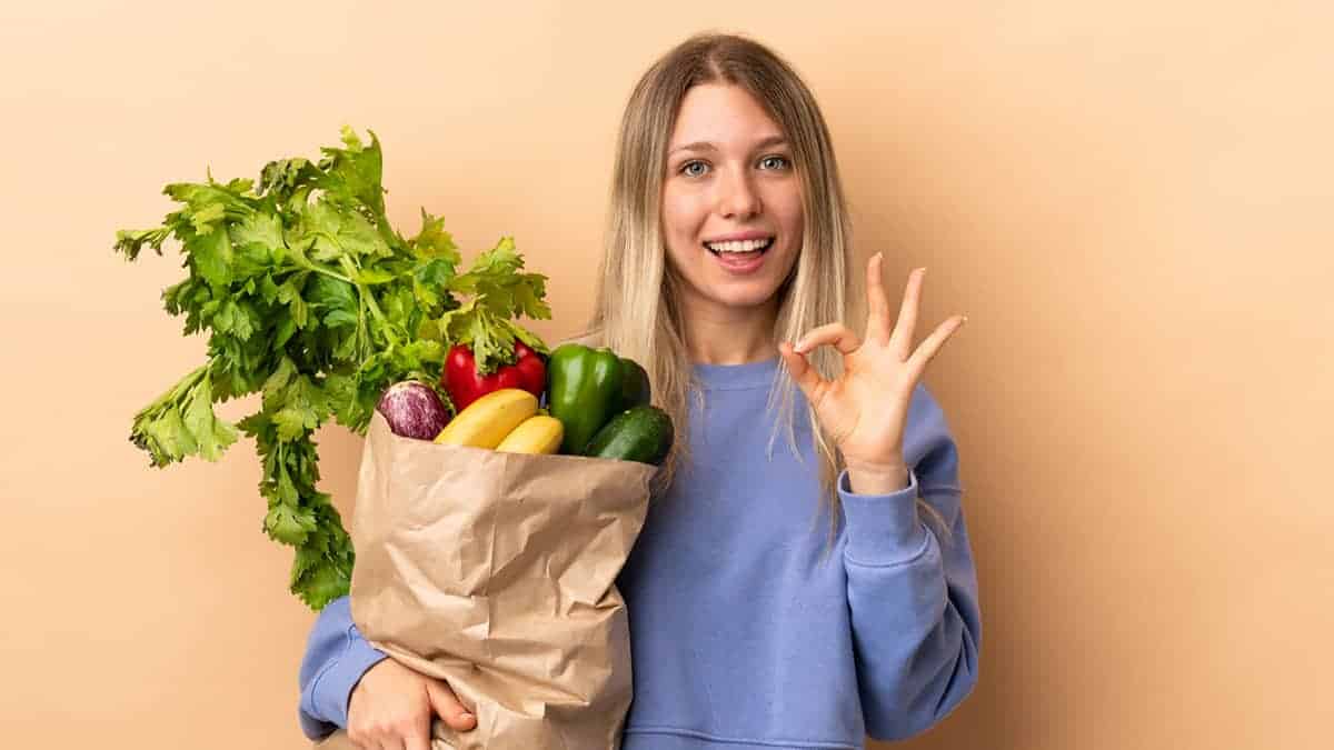 woman with bag of groceries